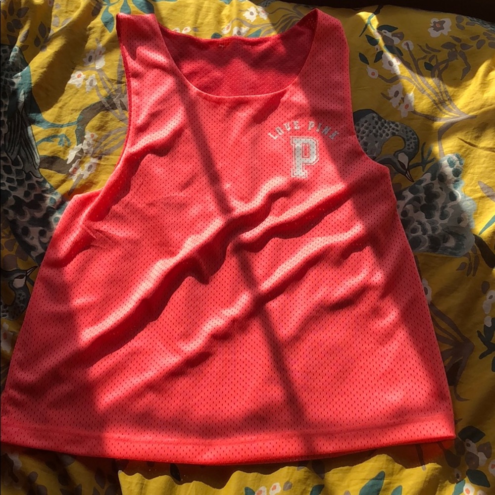 Reversible pink mesh workout muscle tee